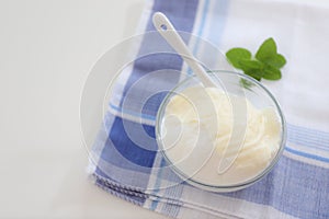 Natural yogurt or yoghurt with cream and mint