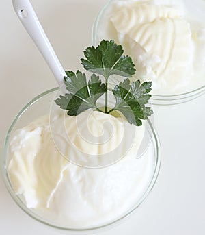 Natural yogurt or yoghurt with cream and parsley