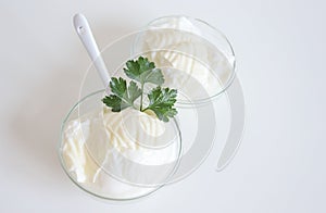 Natural yogurt or yoghurt with cream and parsley