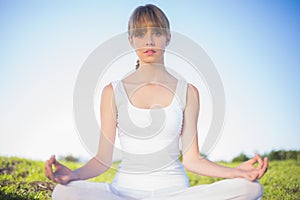 Natural young woman relaxing doing yoga