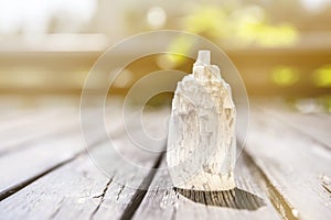 Naturally carved mineral stone Selenite tower. photo