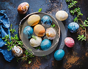 Naturally colored Easter eggs on grunge background, top view