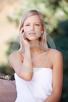 Naturally gorgeous. Portrait of a beautiful young blonde woman sitting after a relaxing spa treatment.