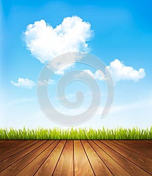 Nature background with a blue sky and heart shaped cloud.