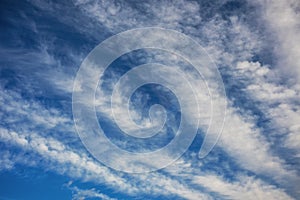 Nature background: Elongated clouds against the blue sky