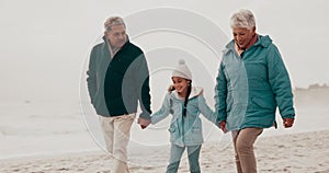 Nature, beach and child holding hands with grandparents outdoors on holiday, vacation and weekend. Winter, travel and