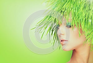 Nature beauty woman with fresh grass hair.