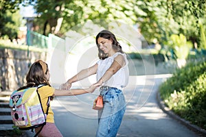 Mother and daughter having fun outside