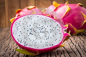 Nature can be pretty weird sometimes, Dragon-fruit are nutritious tropical fruit That way your fruits setup on wooden background.