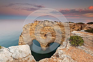 Nature celebrates Valentines Day with the symbol of love carved by nature. Algarve, Portugal.  Seascape of romantic scenario. Hear