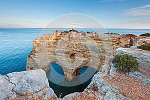 Nature celebrates Valentines Day with the symbol of love carved by nature. Algarve, Portugal.  Seascape of romantic scenario. Hear