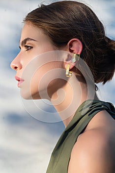 Nature close up portrait of young sensual woman outdoor. American woman portrait outdoors. Beautiful natural woman in