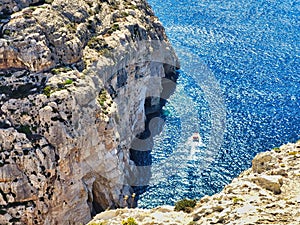 Nature composition. Mediterranean sea shore. Unique volcanic rock formation. View from above. Horizontal photo with view down on