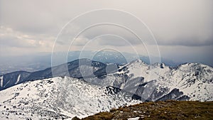 Nature covered in the snow during cold Winter in the country on the hills.