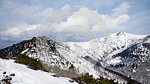 Nature covered in the snow during cold Winter in the country on the hills.