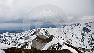 Nature covered in the snow during cold Winter in the country on the hills.