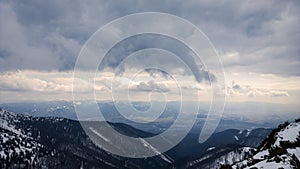 Nature covered in the snow during cold Winter in the country on the hills.