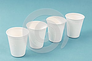 Nature cup from bagasse for drink water on blue background