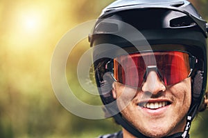 Nature, cycling and man with helmet portrait and excited face with goggles for adventure closeup. Happy and young