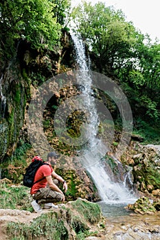 Nature explorer by the waterfalls