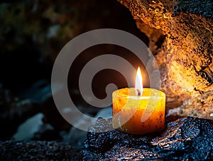 Nature and fire concept, A burning candle in a cave