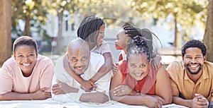 Nature, garden and portrait of a happy black family relaxing together while on summer vacation. Smile, park and positive