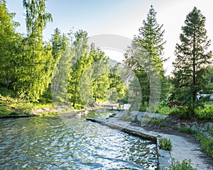 Nature of green trees and cascade of river near Medeo in Almaty, Kazakhstan