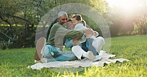 Nature, hug and kid bonding with her parents at an outdoor park while on picnic together. Happiness, smile and girl