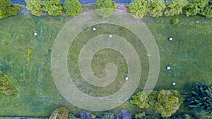 Nature and landscape: Aerial view of a field, plowed field, cultivation, green grass, haystacks, hay bales