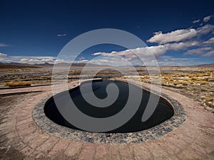 Nature landscape panorama view of outdoor swimming pool Termas de Polques hot springs Uyuni Potosi Sur Lipez Bolivia