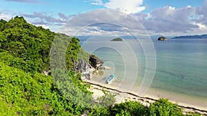 Nature landscape: Sandy tropical beach with crystal clear sea. Rocks and tropical beach in Caramoan island, Philippines