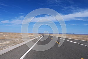 Nature landscape view of high way road under sunny blue sky in Dunhuang Gansu China