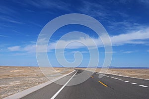 Nature landscape view of high way road under sunny blue sky in Dunhuang Gansu China