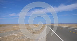 Nature landscape view of high way road under sunny blue sky in Dunhuang Gansu China