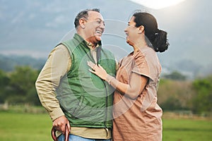 Nature, laughing and senior couple outdoor in with love, care and commitment to happy partner. Elderly man and a woman