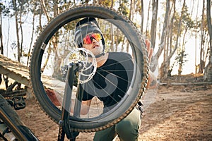 Nature, man and bike with tire repair, wheel change or maintenance on broken bicycle in forest for workout. Person