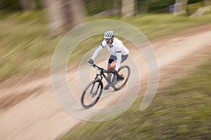 Nature, mountain bike speed and sports man travel, action and ride bicycle for cycling, fitness or exercise. Top view