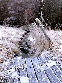 Nature in Norway a winterday. Waterfall and a fence and snow photo