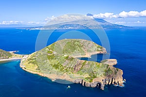 Extinct volcano craters of Caldeirinhas, mount Guia, Horta, Faial island with the peak of Pico volcanic mountain, Azores, Portugal photo