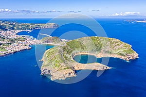 Nature Park, destructed extinct volcano craters of Caldeirinhas, mountain Guia, Baia do Porto Pim and port, Faial island, Portugal photo