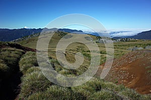 Nature of Patagonia, Hills covered with grass, smal ravine on mountainside of volcano Puyehue in Puyehue National Park