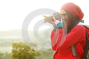 Nature photographer during hiking trip