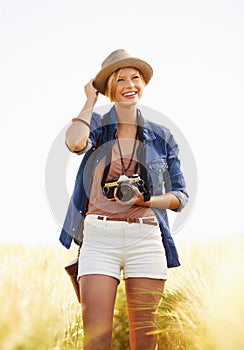 Nature, photography and woman with a camera, smile and journey with adventure, travel and memory with sunshine. Happy