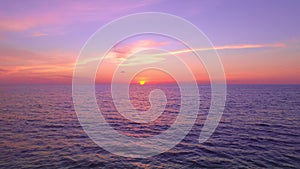 Nature sea sunset background.Tropical sea at sunset or sunrise over sea video 4K, The sun touches horizon, Red sky in golden hour