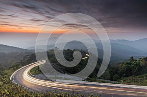 Nature sunrise background amazing curve road and twilight color long exposure view. Popular travel Mountain in Thailand