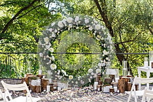 Nature theme in wedding ceremony decoration. Newlyweds arch decorated in rustic style