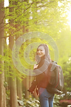 Nature travel photographer woman with Sunshine in spring