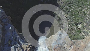 Nature, waterfall and drone in mountain with nature, landscape and top view of water. Rocky cliff, stream and river in
