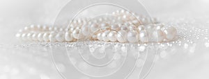 Nature white pearl beads on sparkling background