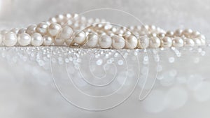 Nature white pearl beads on sparkling background